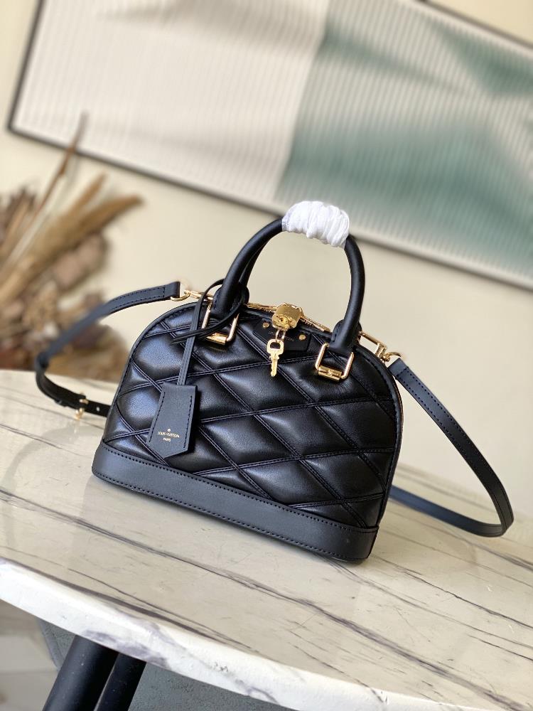 M23666 blackNicolas Ghesquires iconic Alma BB handbag is accented with sheep leather lining creating subtle shadow effects and baking effects injec