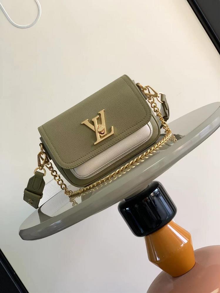 M58557 Avocado Green The Lockme Tender handbag is made of grain leather dipped in a light autumn color paired with polished metal chains and LV twist