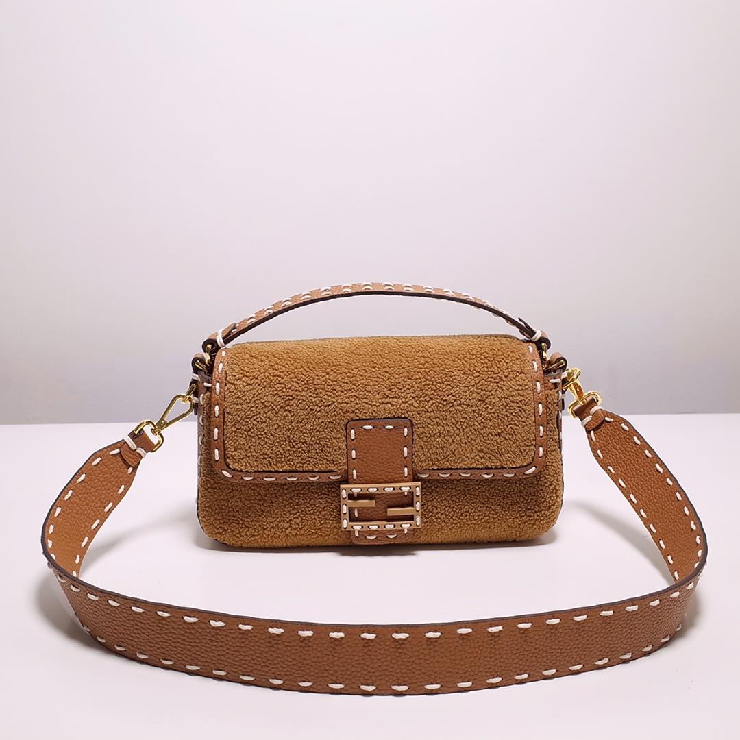 FEND1 signature medium Baguette handbag made of soft brown merino sheepskin with oversized hand stit