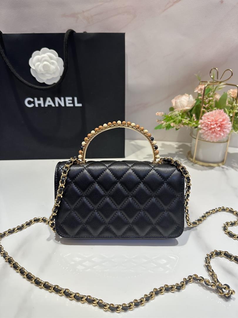 The Chanel 23A Wooden Bead Handle Mobile Phone Bag Handicraft Workshop series features exq