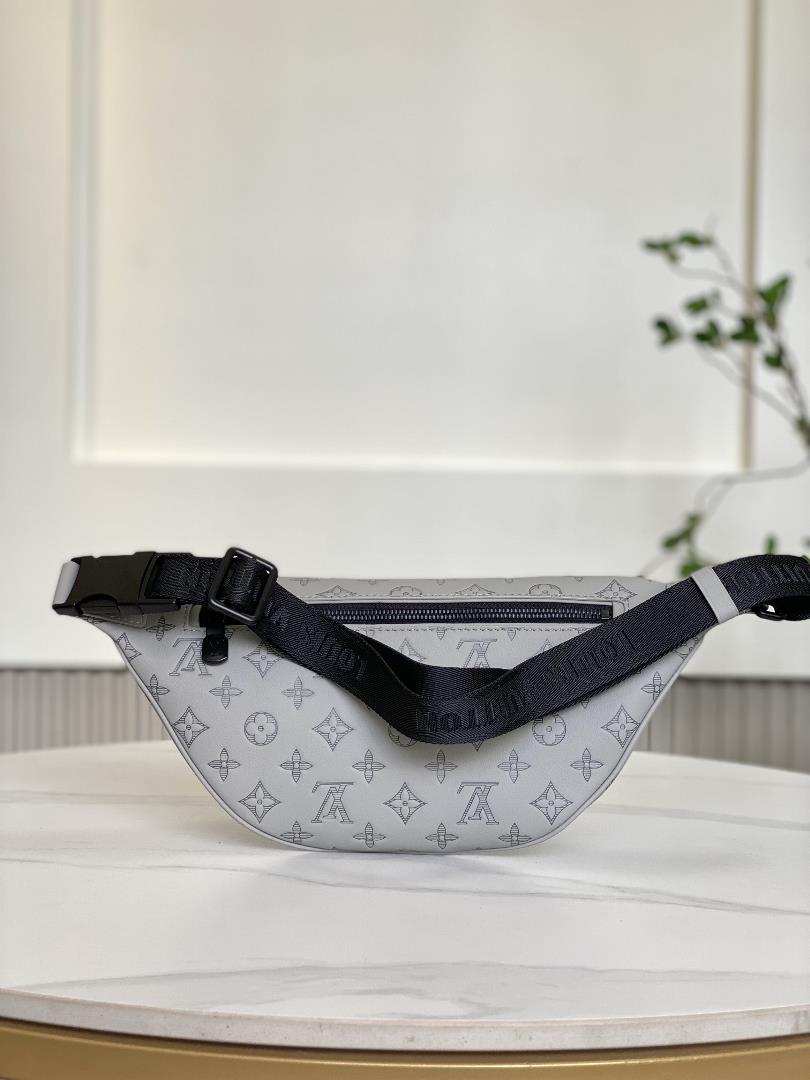 M46036 New Grey EmbossedThis Discovery waist pack is made of soft Monogram Shadow embossed