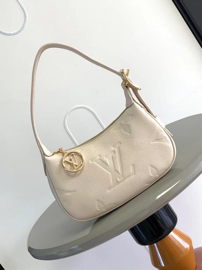 The M82391 M82519 Mini Moon handbag is made of soft Monogram Imprente embossed leather allowing eye