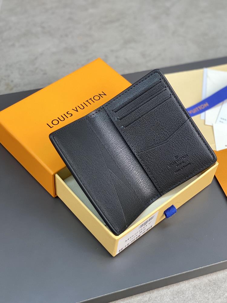 The N82507 Blue Card Bag features a luxurious ostrich leather clip showcasing Louis Vuitt