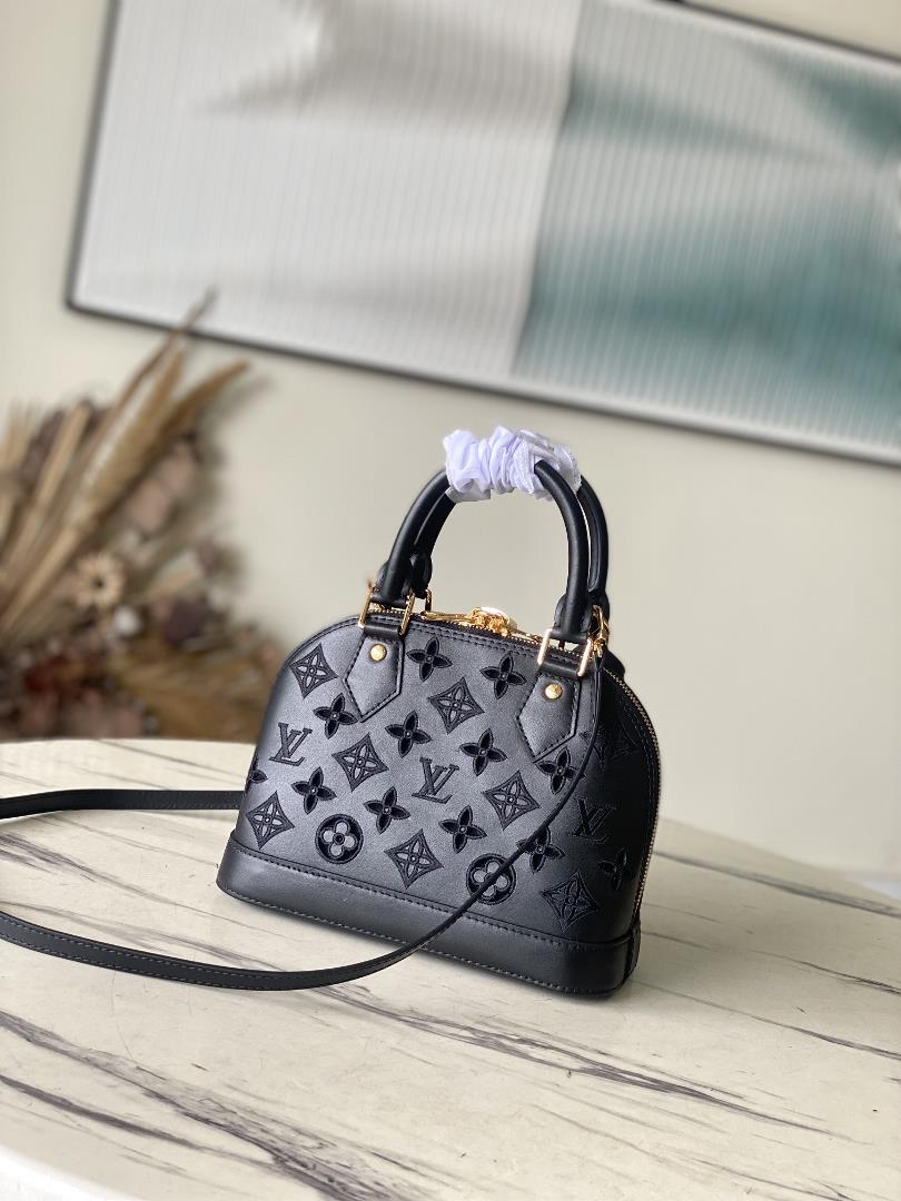 M22878 black 91606 perforated blackThis Alma BB handbag originates from the LV Broderie An