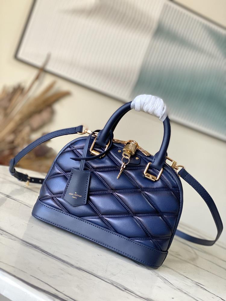 M23666 blueNicolas Ghesquires iconic Alma BB handbag is accented with sheep leather lining creating subtle shadow effects and baking effects inject