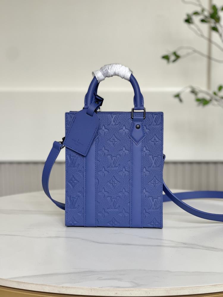 M46453 full leather embossed as a compact version handbag in the Sac Plat series the Sac Plat mini handbag combines Monogram embossed grain Taurillon