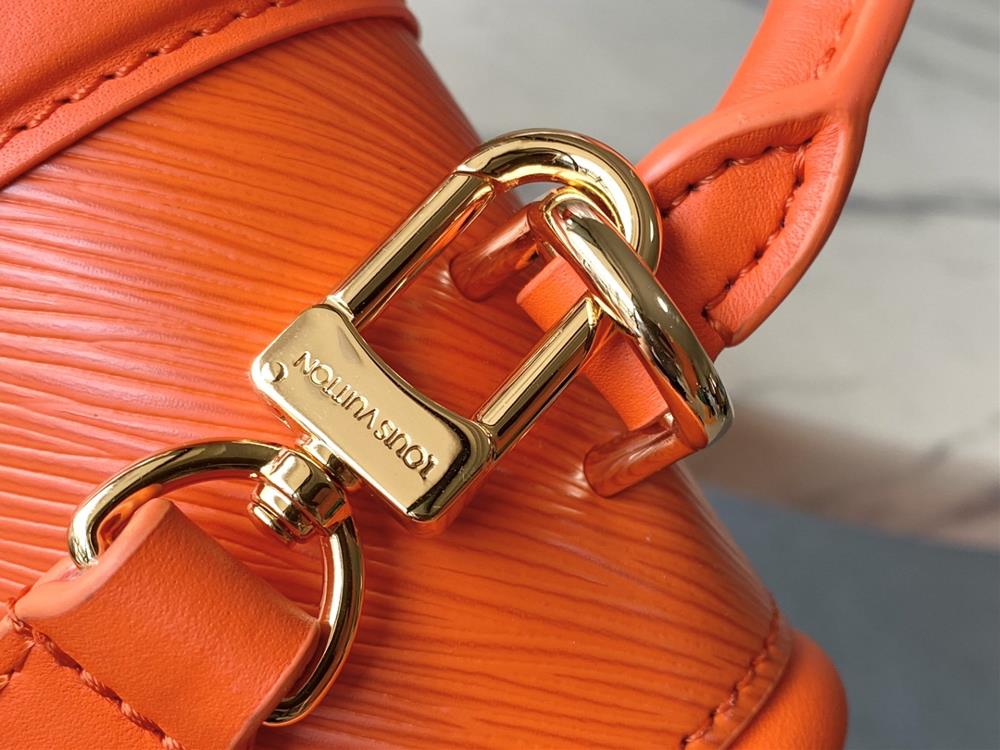 M22723 Orange This Hide Seek handbag features Epi leather accents in bright tones featuri