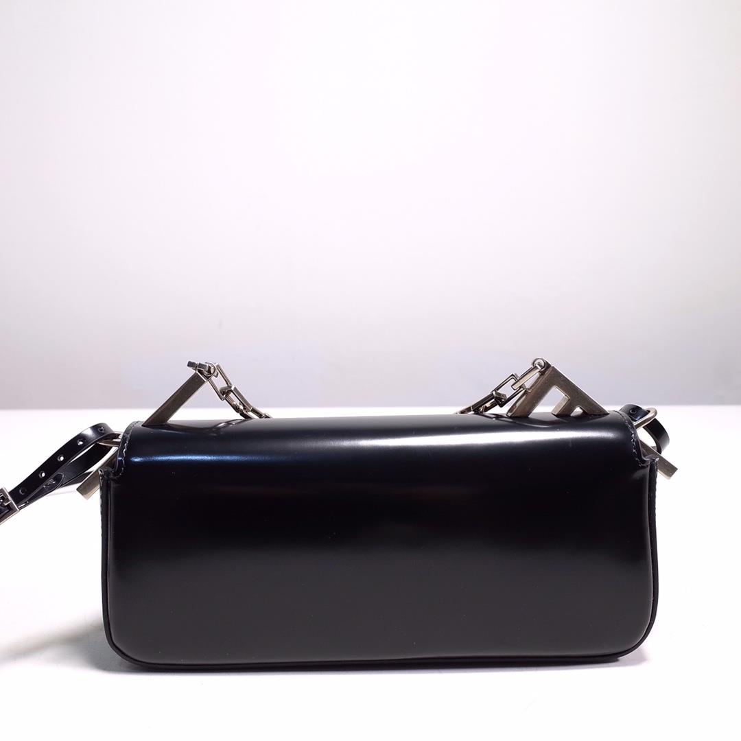 The FENDI handbag is made of black brushed leather material decorated with large F metal acces