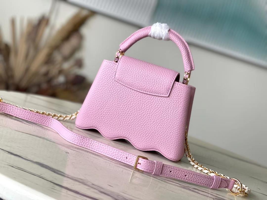 m22122 light purple mini capushell mini handbag is designed with new capucines at the bott