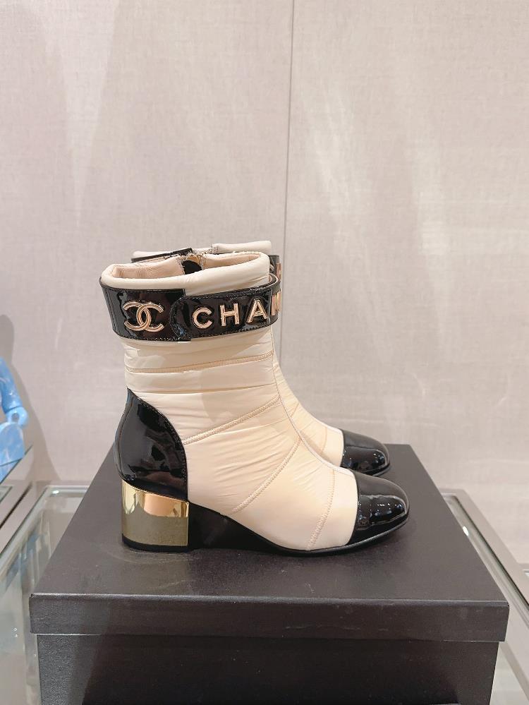 Xiaoxiang Chane Autumn and Winter Down Thick Heel Short BootsThe down bun feels warm and light on the feet and I really love the overall design Its