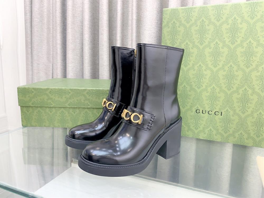 Bright surface  Gucci  Counter New Metal Letter Buckle High Heel Ankle Boots This womens ankle boot is crafted in black leather with eyecatching Guc