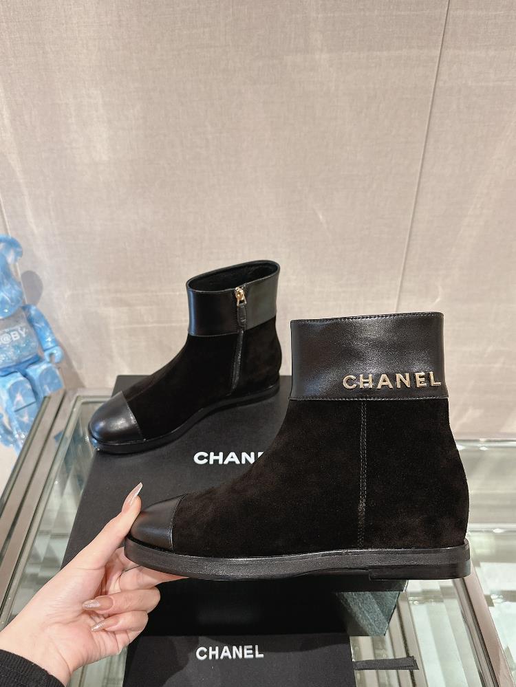 One of my favorite ways to style my Chanel boots is with a little black dress The contras